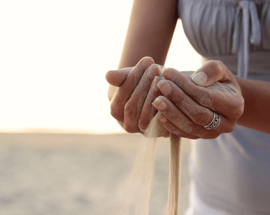 sand-through-fingers