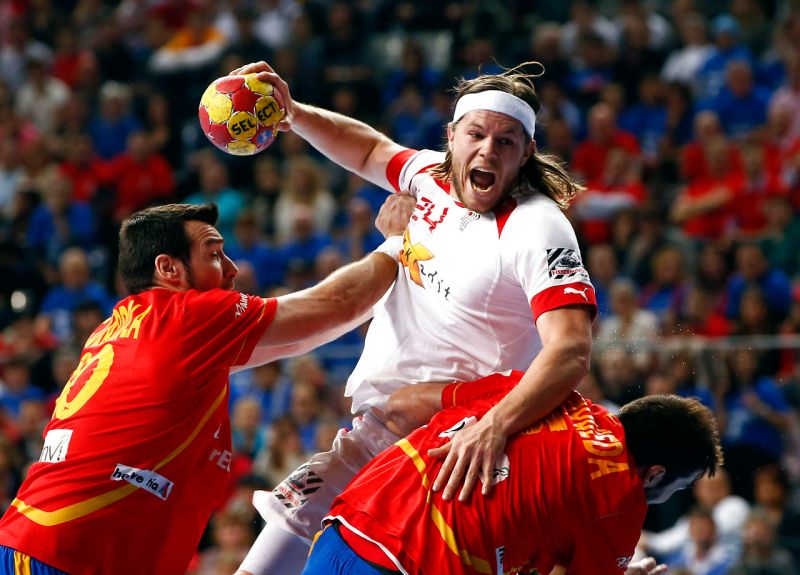 Denmark's Hansen is challenged by Spain's Guardiola during their Men's Handball World Championship final match in Barcelona